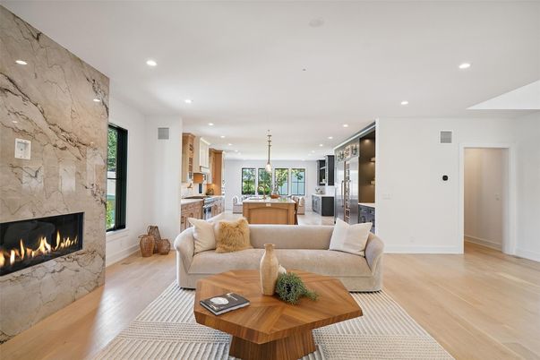 Fireplace, Interior, Kitchen, Living room, Marble Walls, Pendant Lights, Recessed Lighting, Stainless Steel Appliances, Wood Texture Flooring