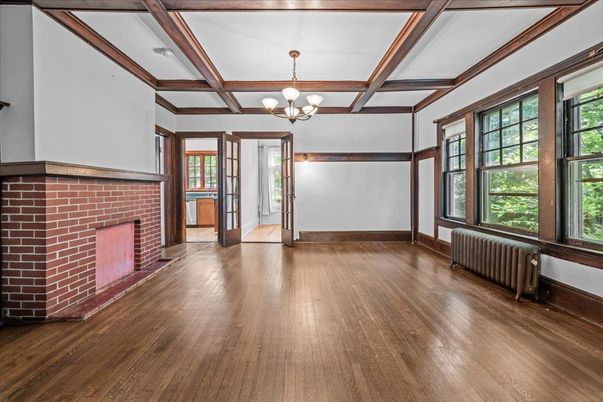 Chandelier, Empty room, Fireplace, Interior, Stone Walls, Wooden Beams, Wood Texture Flooring
