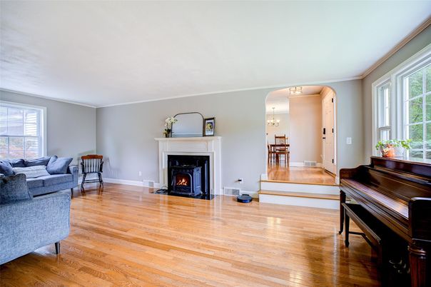 Chandelier, Dining room, Fireplace, Interior, Living room, Piano, Wood Texture Flooring