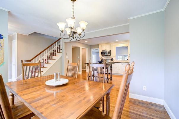 Chandelier, Dining room, Interior, Kitchen, Recessed Lighting, Stainless Steel Appliances, Wood Texture Flooring