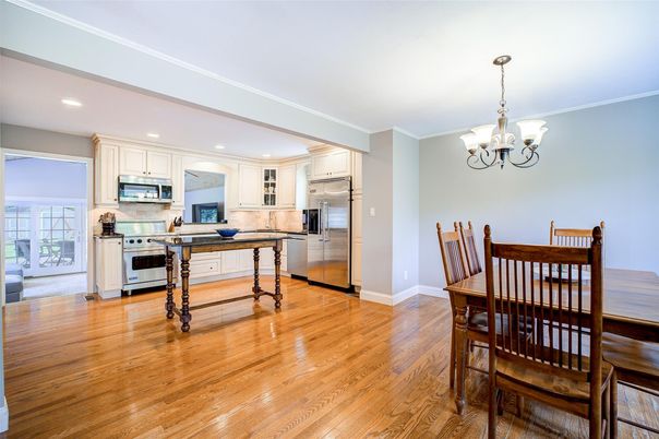 Chandelier, Dining room, Interior, Kitchen, Recessed Lighting, Stainless Steel Appliances, Wood Texture Flooring