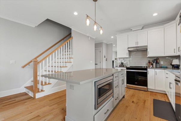 Interior, Kitchen, Pendant Lights, Recessed Lighting, Stainless Steel Appliances, Wood Texture Flooring