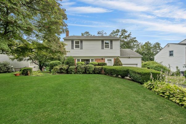 Attached, Backyard, Exterior, Facade, Brick Facade, Raised Ranch