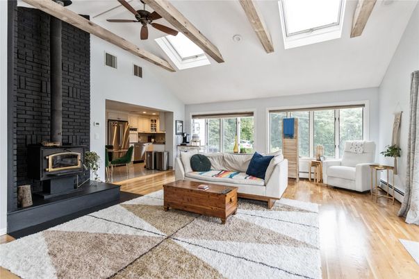 Fireplace, Interior, Kitchen, Living room, Recessed Lighting, Stainless Steel Appliances, Stone Walls, Wooden Beams, Wood Texture Flooring