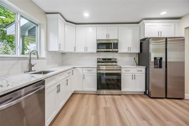 Interior, Kitchen, Recessed Lighting, Stainless Steel Appliances, Wood Texture Flooring