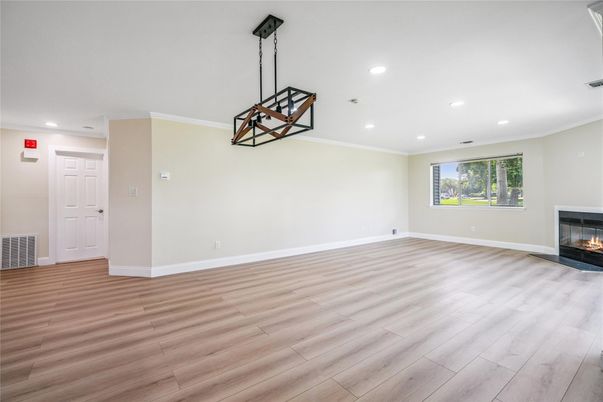 Empty room, Fireplace, Interior, Pendant Lights, Recessed Lighting, Wood Texture Flooring