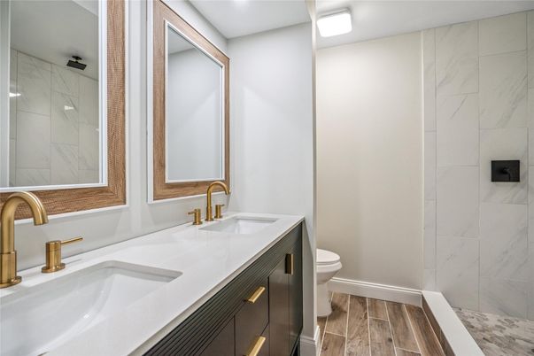 Bathroom, Dual Sink Vanities, Interior, Marble Walls, Wood Texture Flooring