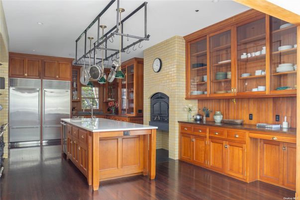 Fireplace, Interior, Kitchen, Recessed Lighting, Stainless Steel Appliances, Stone Walls, Wood Texture Flooring