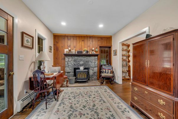 Fireplace, Home Office, Interior, Recessed Lighting, Wood Texture Flooring, Wooden Walls