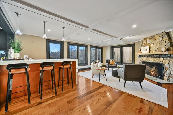 Fireplace, Interior, Living room, Pendant Lights, Recessed Lighting, Stone Walls, Wood Texture Flooring