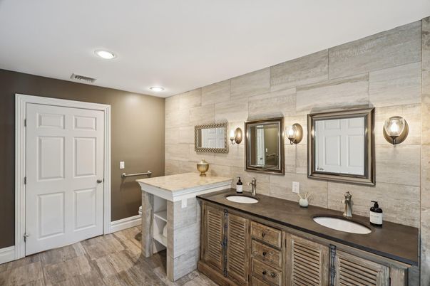 Bathroom, Dual Sink Vanities, Interior, Recessed Lighting, Stone Walls, Wood Texture Flooring