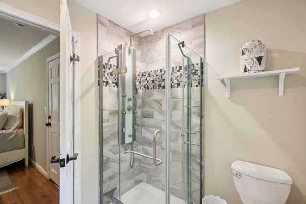 Bathroom, Glass Shower, Interior, Marble Walls, Recessed Lighting, Wood Texture Flooring