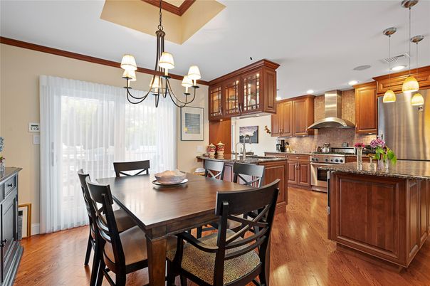 Chandelier, Dining room, Interior, Kitchen, Pendant Lights, Recessed Lighting, Stainless Steel Appliances, Wood Texture Flooring
