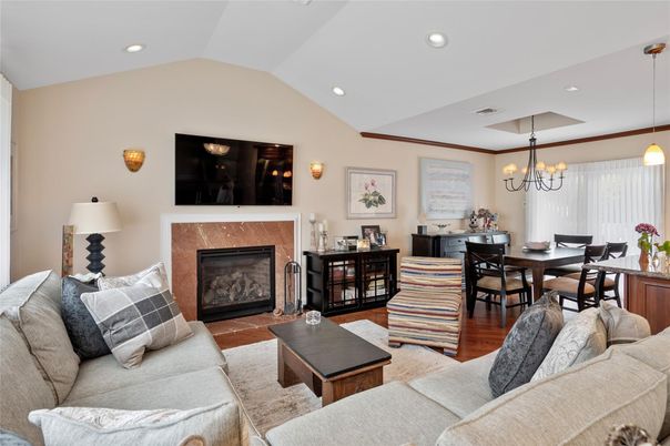 Chandelier, Dining room, Fireplace, Interior, Living room, Pendant Lights, Recessed Lighting, Wood Texture Flooring