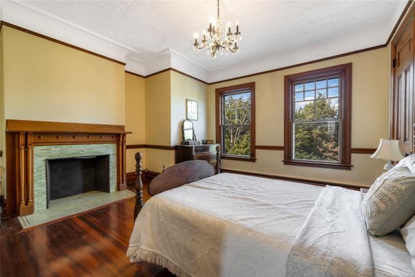 Bedroom, Chandelier, Fireplace, Interior, Wood Texture Flooring