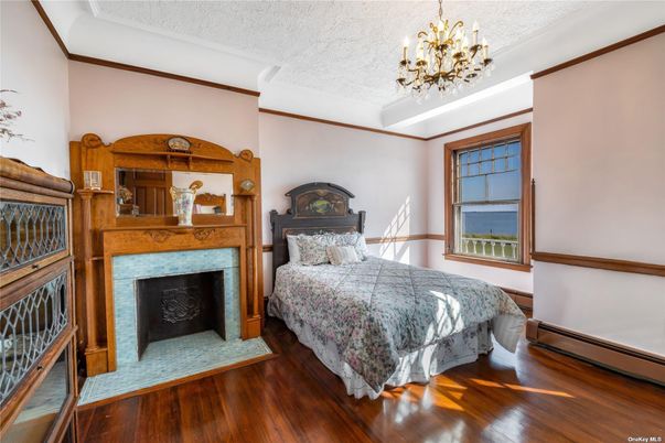 Bedroom, Chandelier, Fireplace, Interior, Wood Texture Flooring