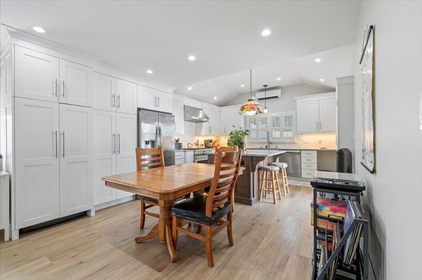Dining room, Interior, Kitchen, Pendant Lights, Recessed Lighting, Stainless Steel Appliances, Wood Texture Flooring