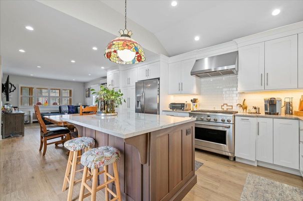Dining room, Interior, Kitchen, Pendant Lights, Recessed Lighting, Stainless Steel Appliances, Wood Texture Flooring