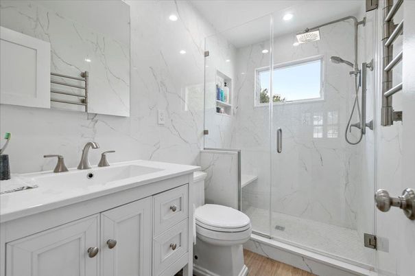Bathroom, Glass Shower, Interior, Marble Walls, Recessed Lighting, Wood Texture Flooring