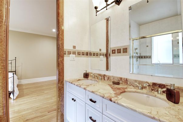 Bathroom, Dual Sink Vanities, Glass Shower, Interior, Recessed Lighting, Wood Texture Flooring