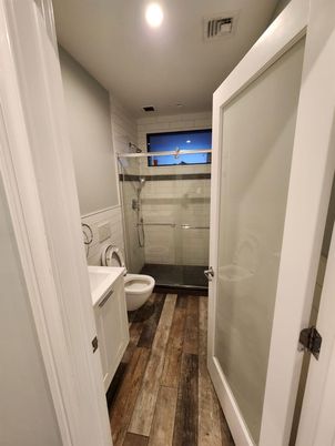 Bathroom, Glass Shower, Interior, Recessed Lighting, Wood Texture Flooring