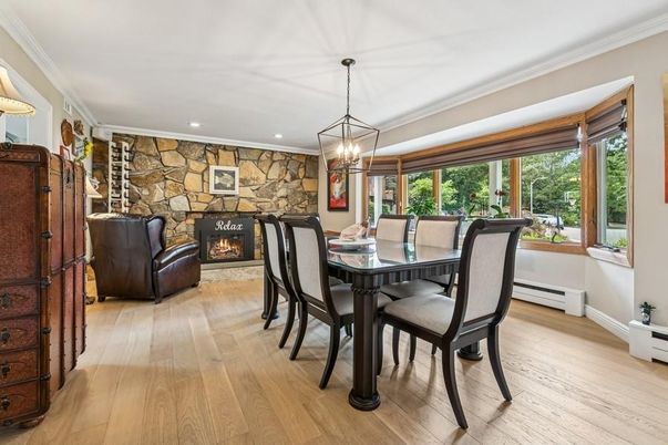 Dining room, Fireplace, Interior, Pendant Lights, Recessed Lighting, Stone Walls, Wood Texture Flooring