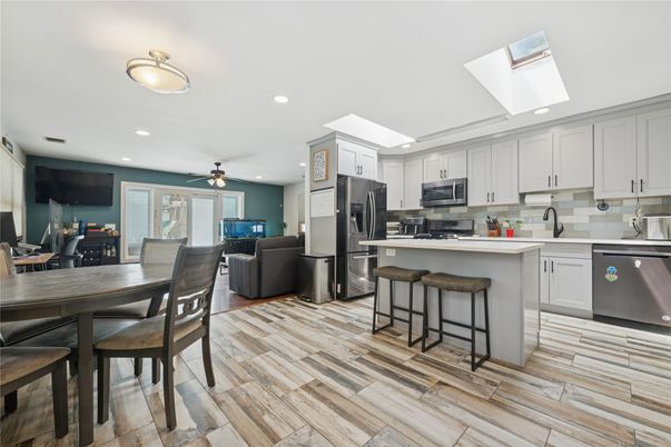 Dining room, Interior, Kitchen, Living room, Recessed Lighting, Stainless Steel Appliances, Wood Texture Flooring