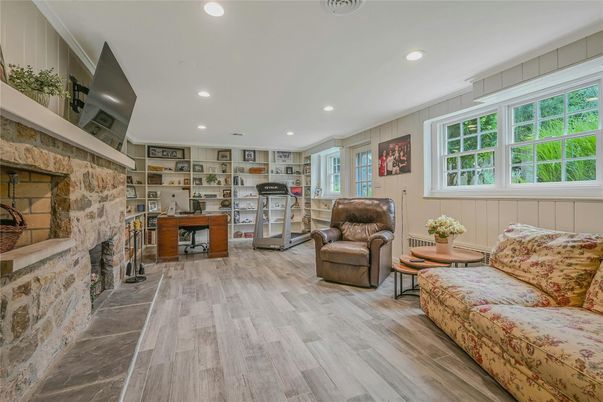 Fireplace, Interior, Living room, Recessed Lighting, Stone Walls, Wood Texture Flooring