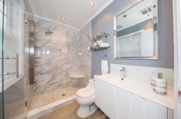 Bathroom, Glass Shower, Interior, Marble Walls, Recessed Lighting, Wood Texture Flooring