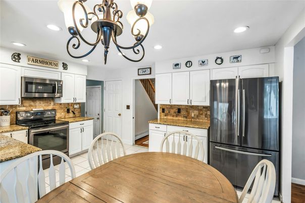 Chandelier, Dining room, Interior, Kitchen, Recessed Lighting, Stainless Steel Appliances, Wood Texture Flooring