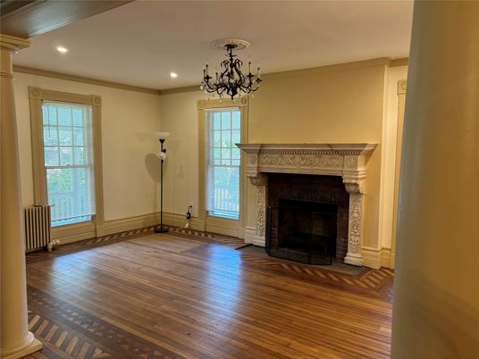 Chandelier, Empty room, Fireplace, Interior, Recessed Lighting, Wood Texture Flooring