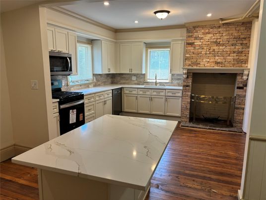 Fireplace, Interior, Kitchen, Recessed Lighting, Stone Walls, Wood Texture Flooring