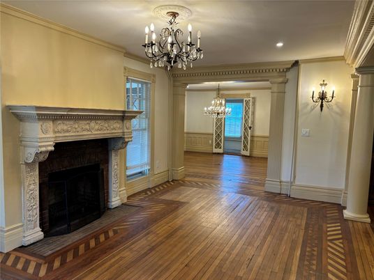 Chandelier, Empty room, Fireplace, Interior, Recessed Lighting, Wood Texture Flooring