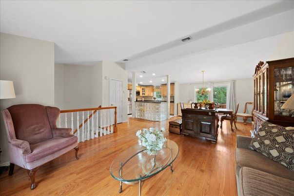 Chandelier, Dining room, Interior, Kitchen, Living room, Pendant Lights, Recessed Lighting, Stainless Steel Appliances, Wood Texture Flooring