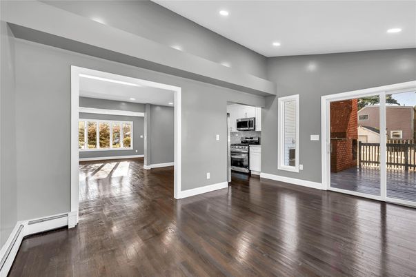 Empty room, Interior, Kitchen, Recessed Lighting, Stainless Steel Appliances, Wood Texture Flooring