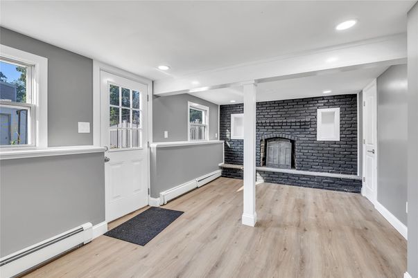 Fireplace, Interior, Recessed Lighting, Stone Walls, Wood Texture Flooring