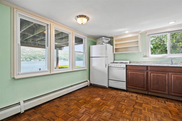 Interior, Kitchen, Recessed Lighting, Washer, Wood Texture Flooring