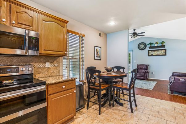 Dining room, Interior, Kitchen, Recessed Lighting, Stainless Steel Appliances, Wood Texture Flooring