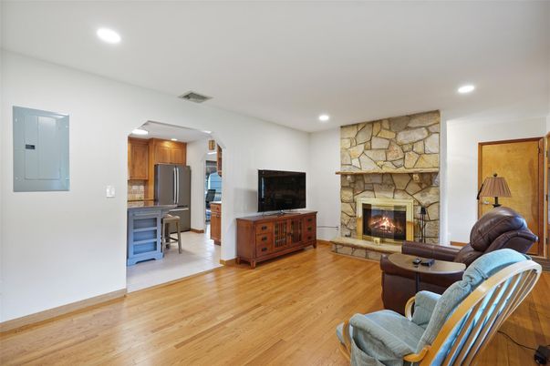 Fireplace, Interior, Kitchen, Living room, Recessed Lighting, Stone Walls, Wood Texture Flooring