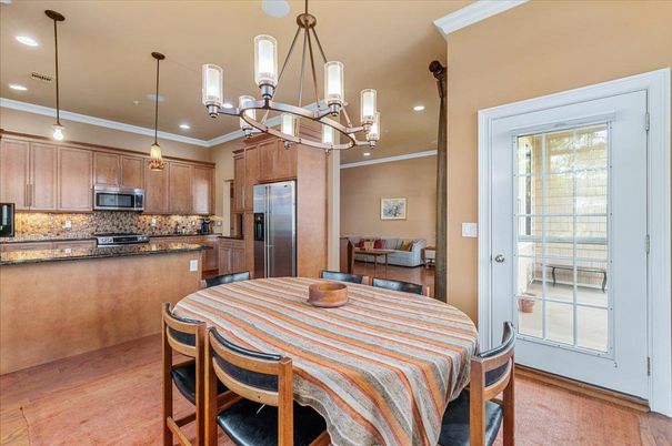 Chandelier, Dining room, Interior, Kitchen, Pendant Lights, Recessed Lighting, Stainless Steel Appliances, Wood Texture Flooring