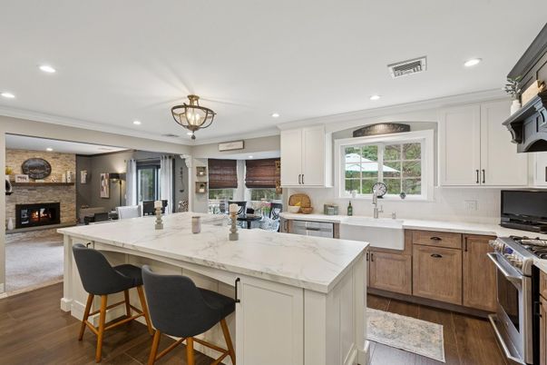 Fireplace, Interior, Kitchen, Recessed Lighting, Stainless Steel Appliances, Stone Walls, Wood Texture Flooring