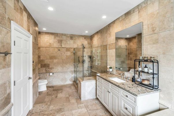 Bathroom, Dual Sink Vanities, Glass Shower, Interior, Recessed Lighting, Stone Walls