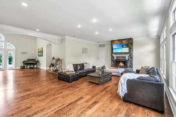 Fireplace, Interior, Living room, Piano, Recessed Lighting, Wood Texture Flooring