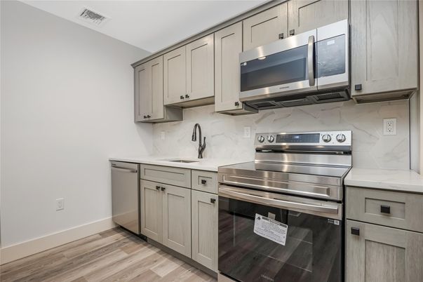 Interior, Kitchen, Marble Walls, Stainless Steel Appliances, Wood Texture Flooring