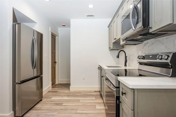 Interior, Kitchen, Recessed Lighting, Stainless Steel Appliances, Wood Texture Flooring