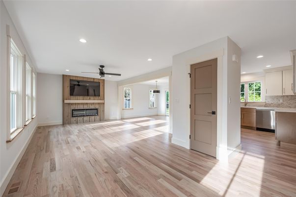 Empty room, Fireplace, Interior, Kitchen, Recessed Lighting, Wood Texture Flooring
