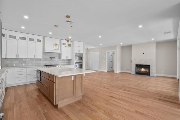 Fireplace, Interior, Kitchen, Pendant Lights, Recessed Lighting, Stainless Steel Appliances, Wood Texture Flooring