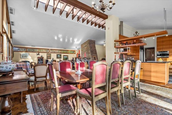 Chandelier, Dining room, Interior, Kitchen, Recessed Lighting, Stainless Steel Appliances, Wooden Beams, Wood Texture Flooring