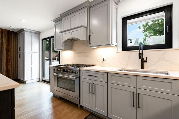 Interior, Kitchen, Marble Walls, Recessed Lighting, Stainless Steel Appliances, Wood Texture Flooring