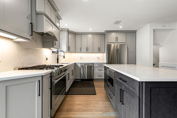 Interior, Kitchen, Marble Walls, Recessed Lighting, Stainless Steel Appliances, Wood Texture Flooring